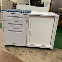 Rolling door pedestal cabinet with three drawer